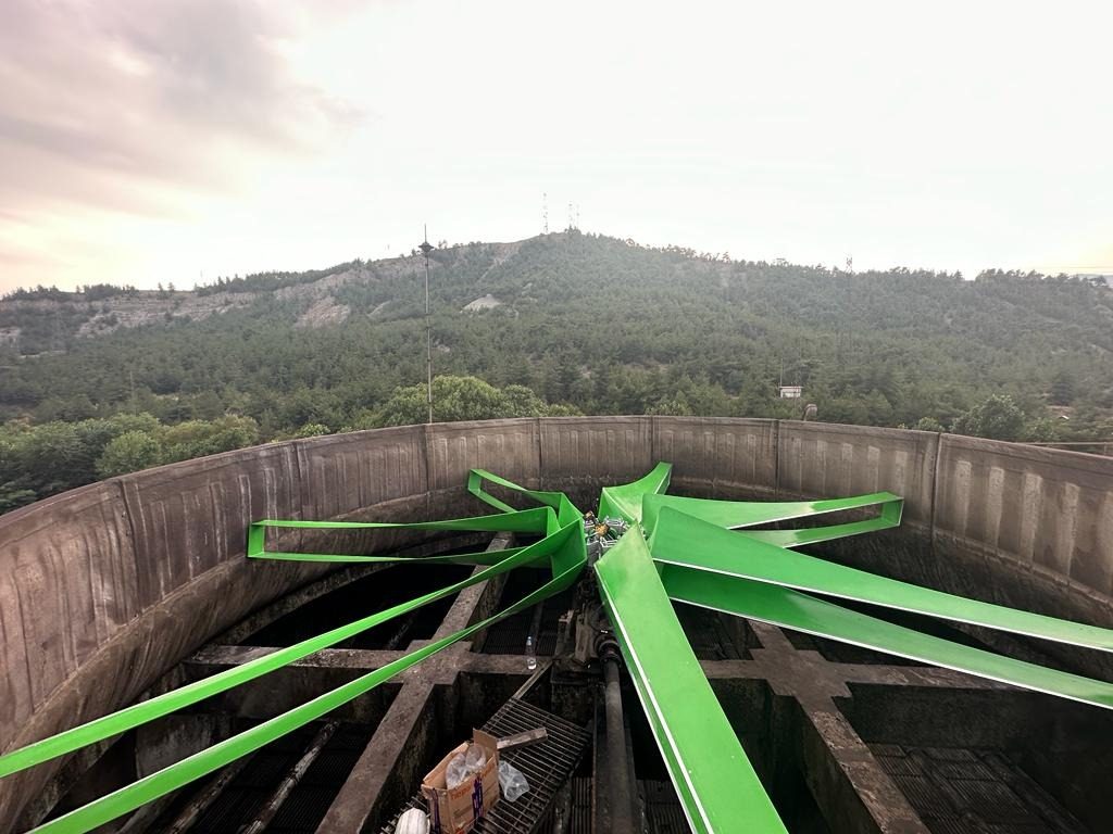 GT Green Fan in a cooling tower with a wooded hill behind