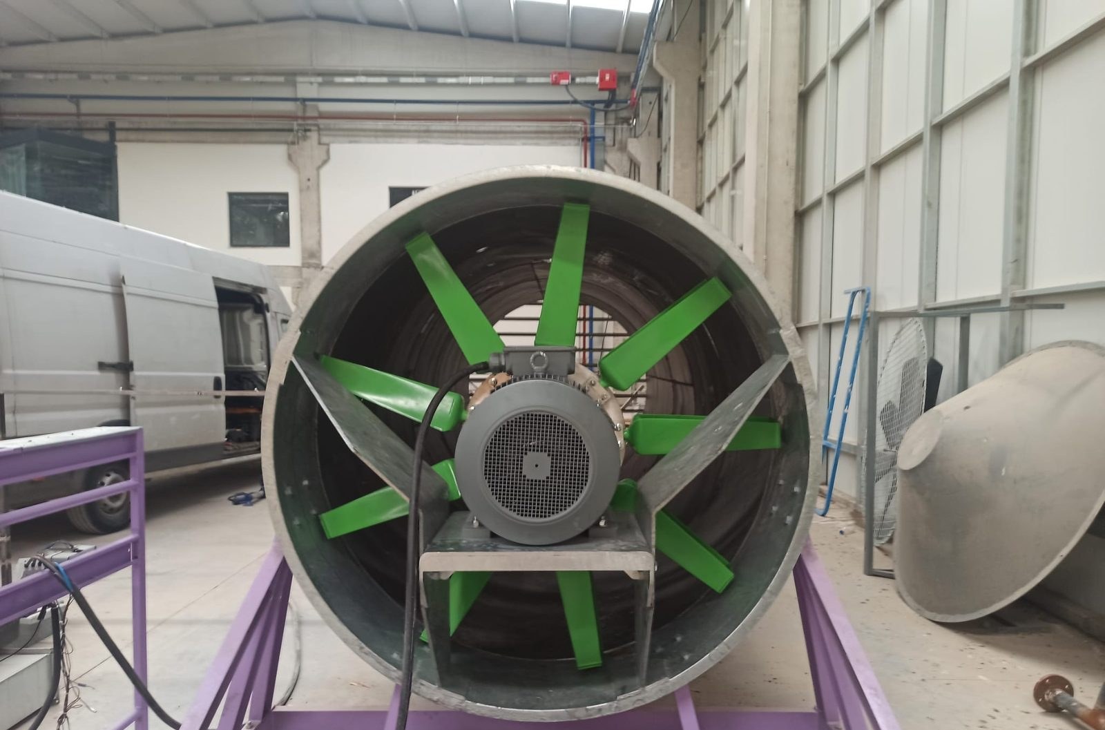 GT Green Fan mounted in a ring casing on a stand in the factory